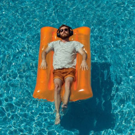Relaxed person floating with eyes closed, mind quiet